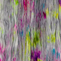 Sysleriget hand dyed yarn in single ply merino wool in the color Dark Side of the Unicorn Party.