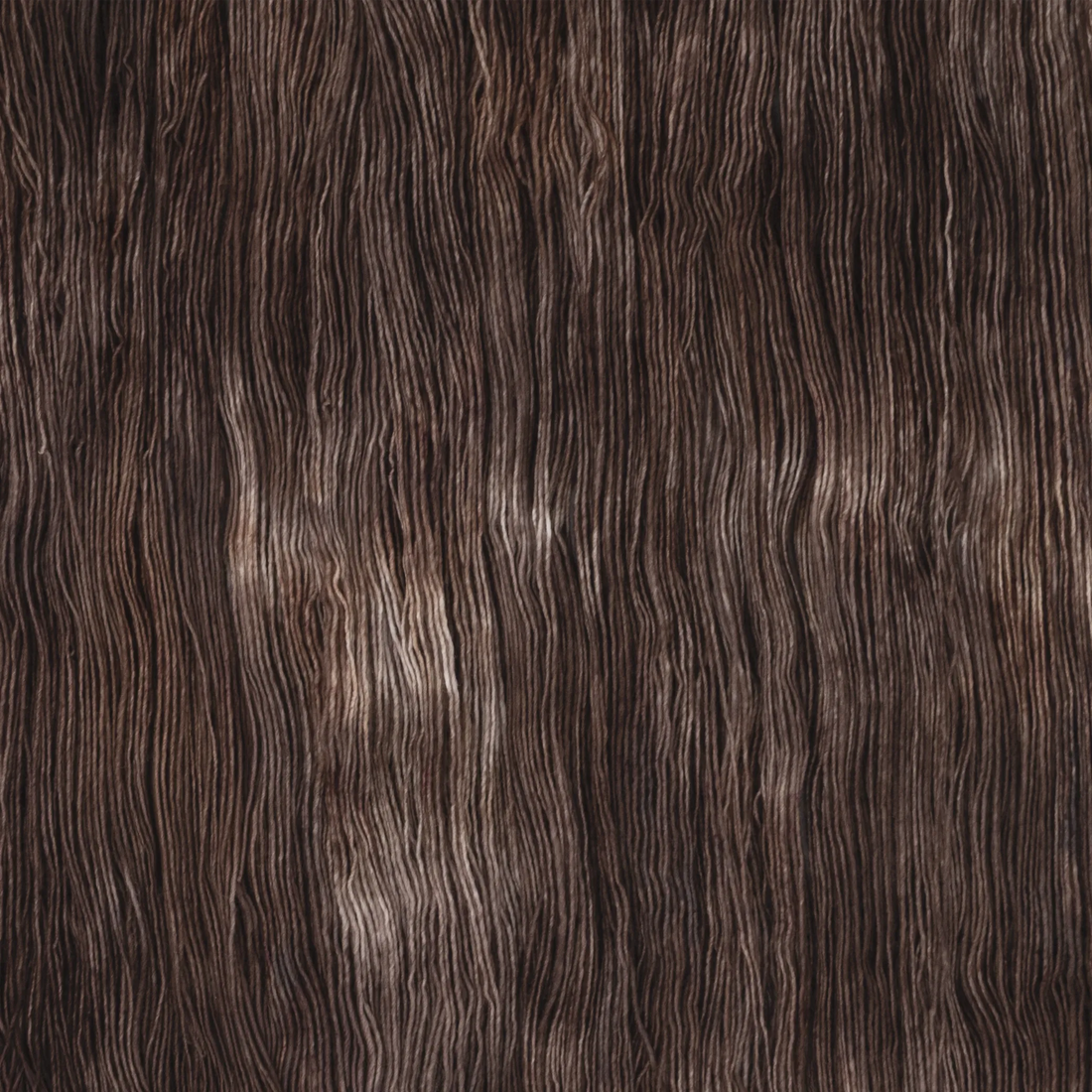 Sysleriget hand dyed yarn in single ply merino wool in the color Gateau Marcel.