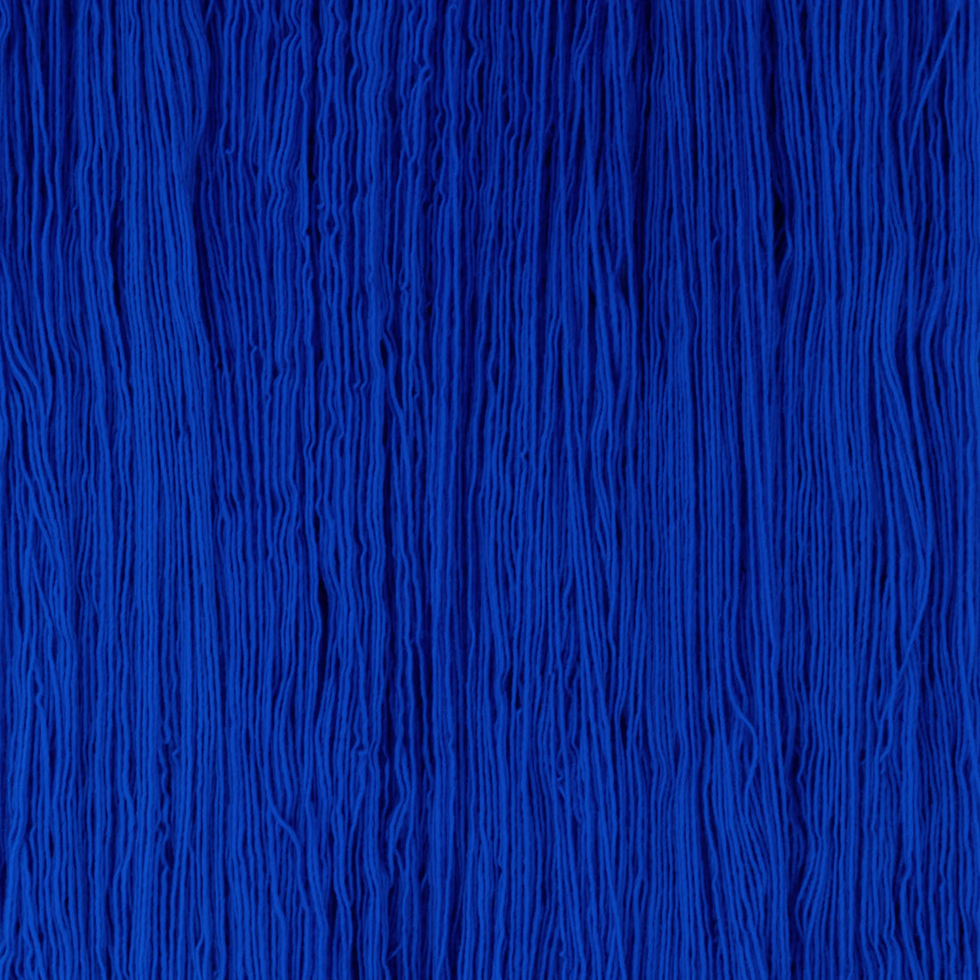 Sysleriget hand dyed yarn in single ply merino wool in the color True Blue.