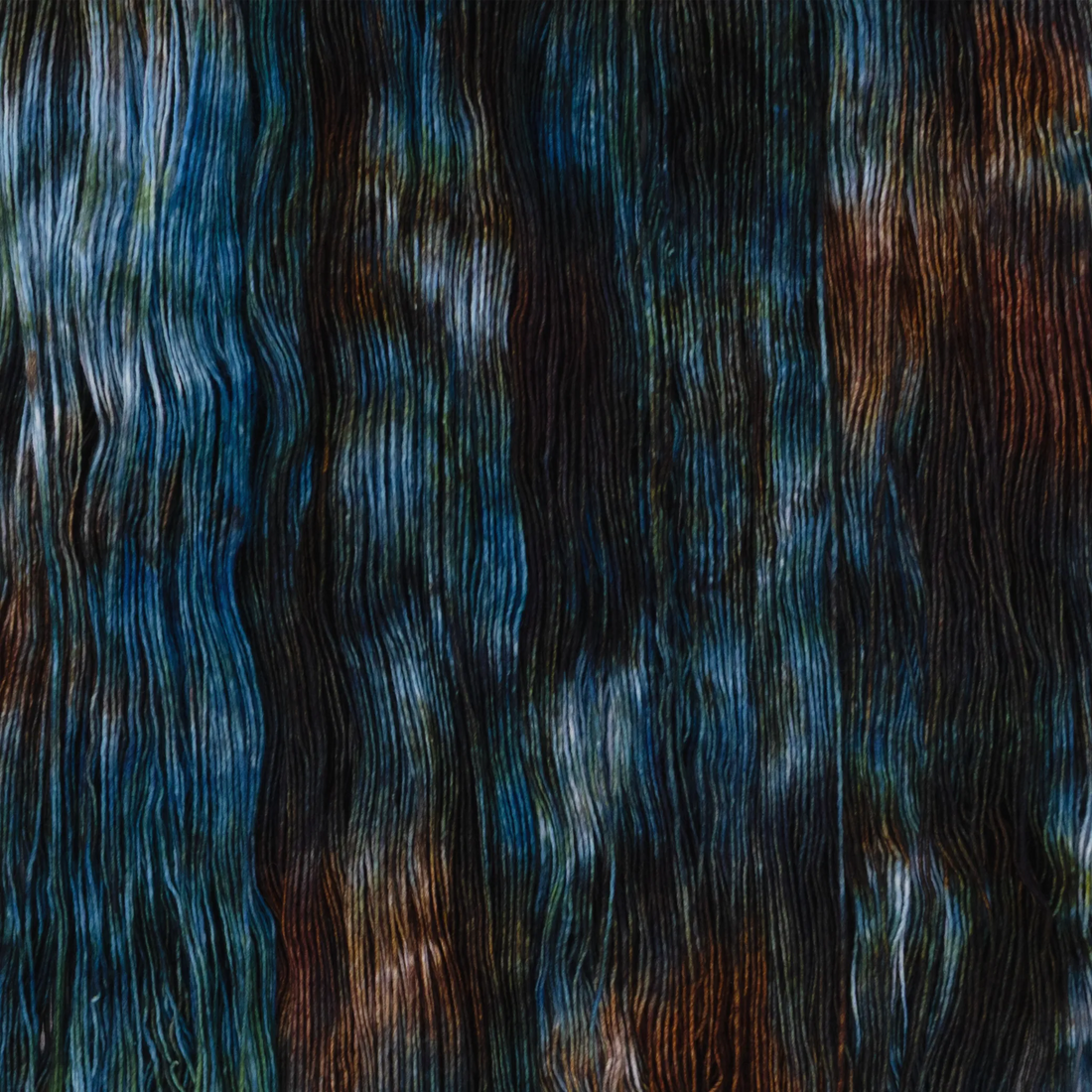 Sysleriget hand dyed yarn in single ply merino wool in the color Twilight in the Woods.